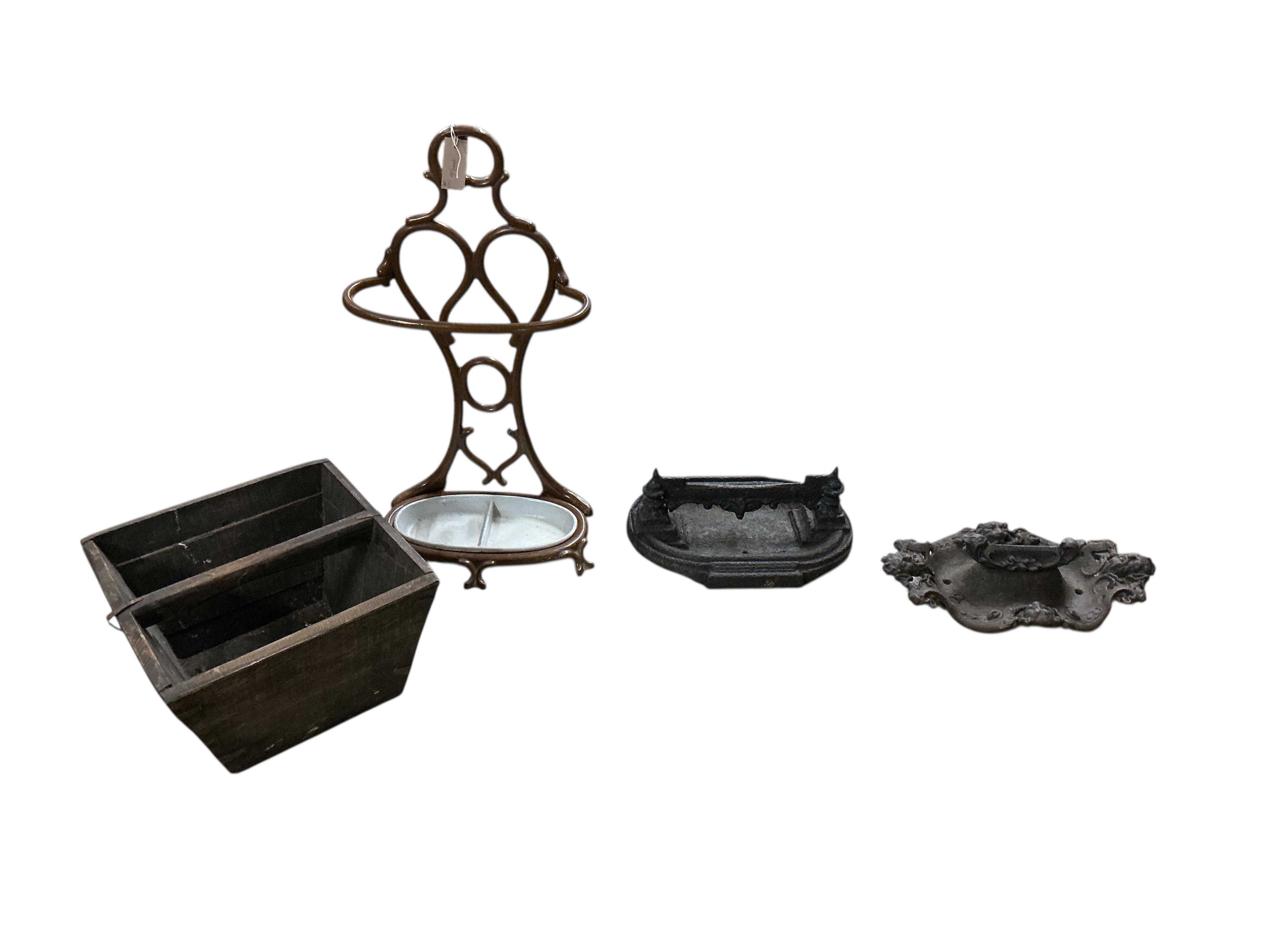 A late Victorian painted cast iron stick-stand, height 70cm, two Victorian cast iron boot scrapers and a square pail